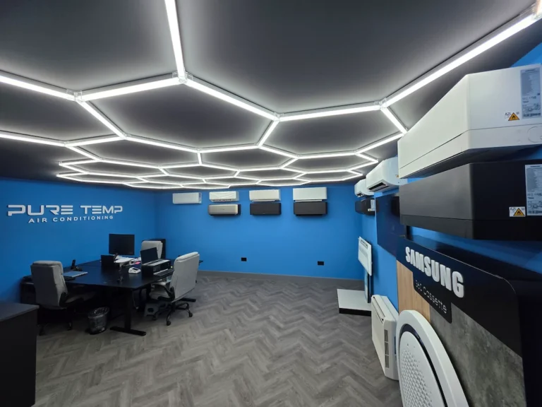 Modern air conditioning showroom with hexagonal ceiling lights